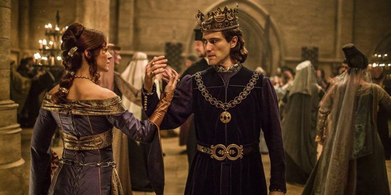 Olivia Ross (Queen Joan) and Ed Stoppard (King Philip) dance a strained dance in Knightfall.
