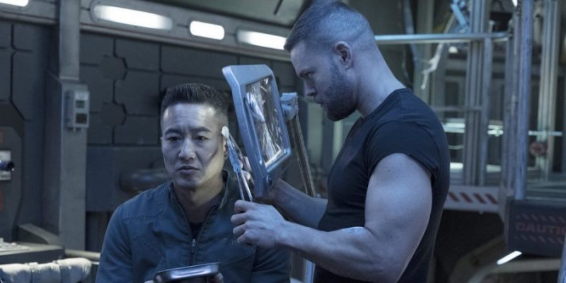 THE EXPANSE -- "Assured Destruction" Episode 303 -- Pictured: (l-r) Terry Chen as Prax, Wes Chatham as Amos Burton -- (Photo by: Rafy/Syfy)