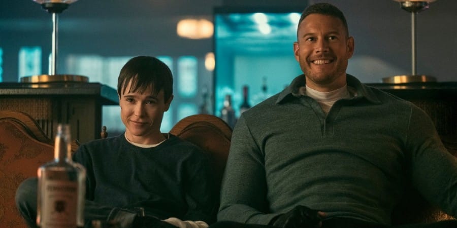 Viktor and Luther smiling while sitting on a couch The Umbrella Academy