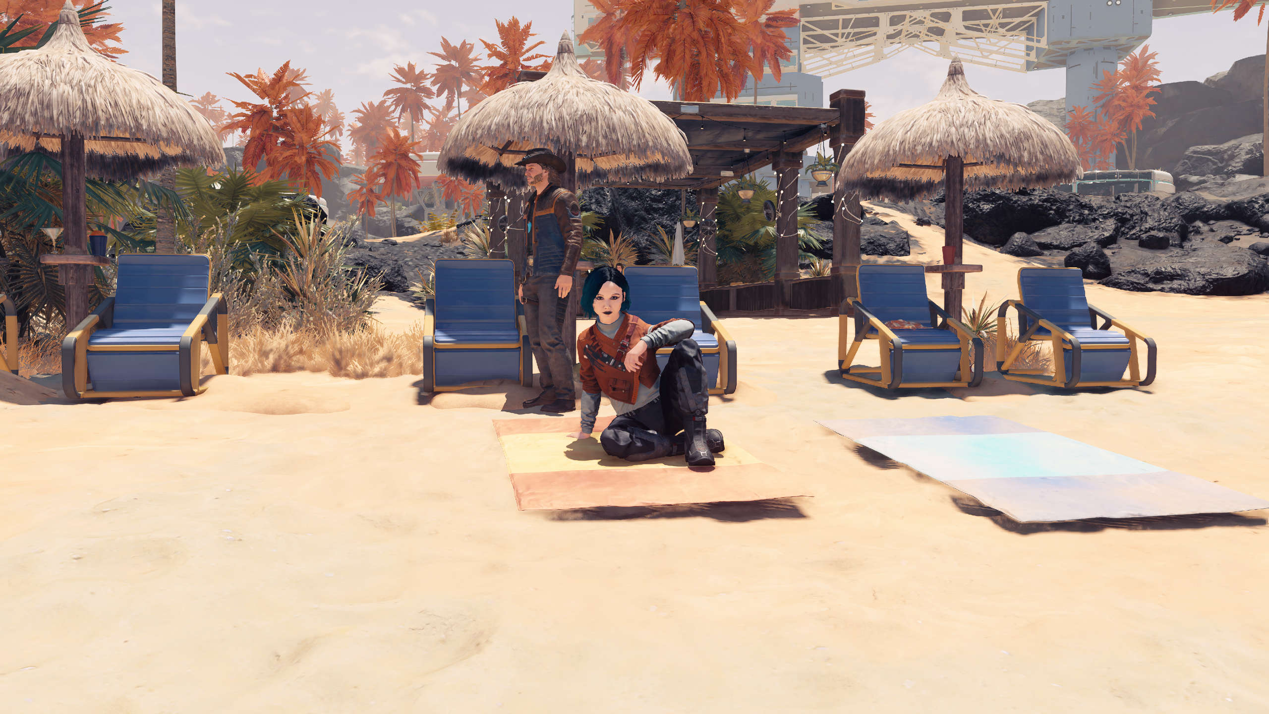 My character sitting on a beach with Sam Coe standing behind her