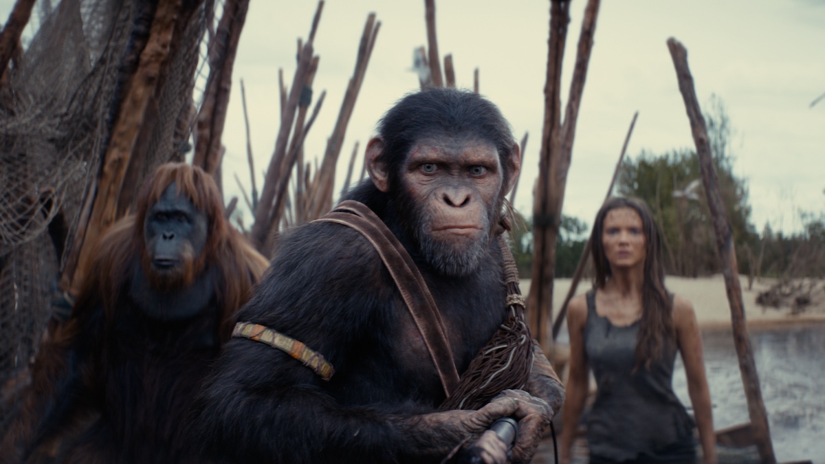 (L-R): Raka (played by Peter Macon), Noa (played by Owen Teague) , and Freya Allan as Nova in 20th Century Studios' KINGDOM OF THE PLANET OF THE APES. Photo courtesy of 20th Century Studios. © 2024 20th Century Studios. All Rights Reserved.